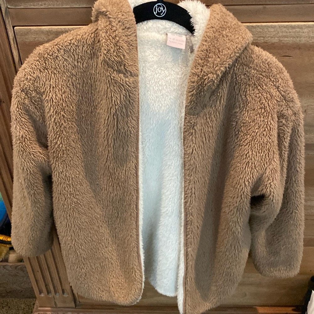 Ugg like sweater.  Chestnut exterior cream interior.